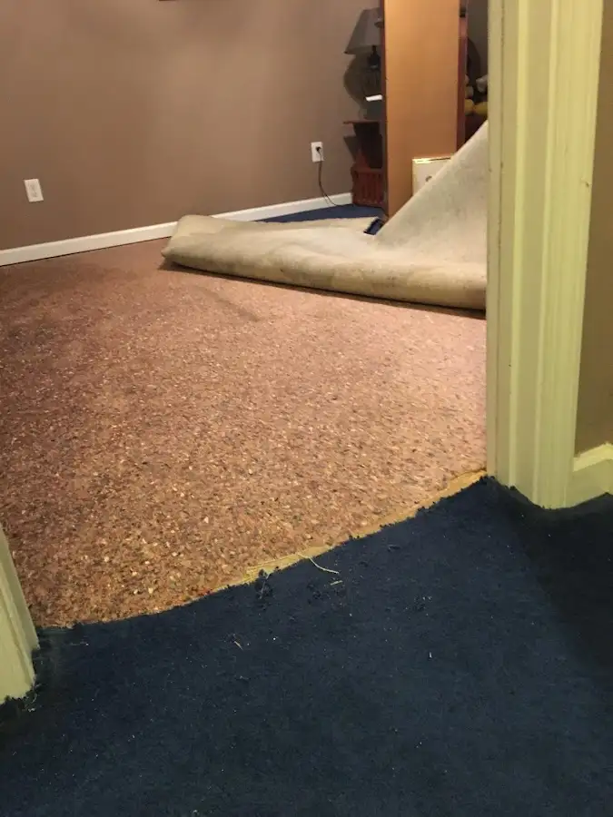 Carpet pad removal revealing water damage during Water Mitigation Services in Bend